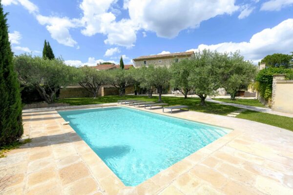 Sumptuous property in the heart of a village, landscaped grounds and 2 pools