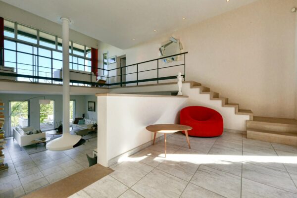 Contemporary property in a dominant position with parkland and pool